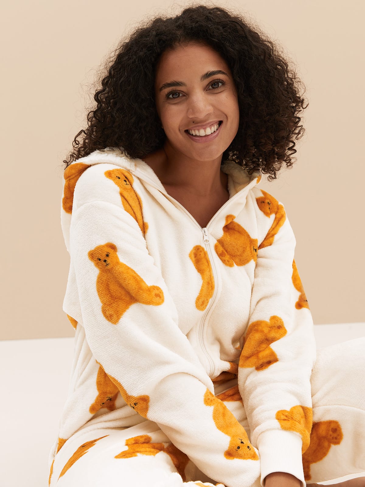 Woman wearing Spencer Bear onesie. Shop now 