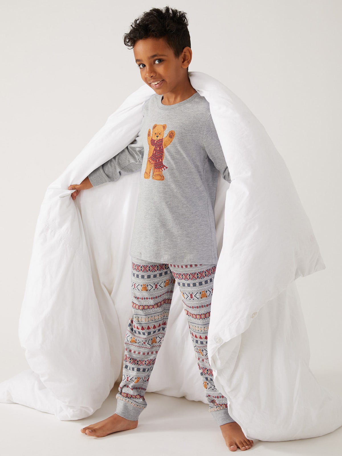 Child wearing Spencer Bear pyjama set. Shop now 