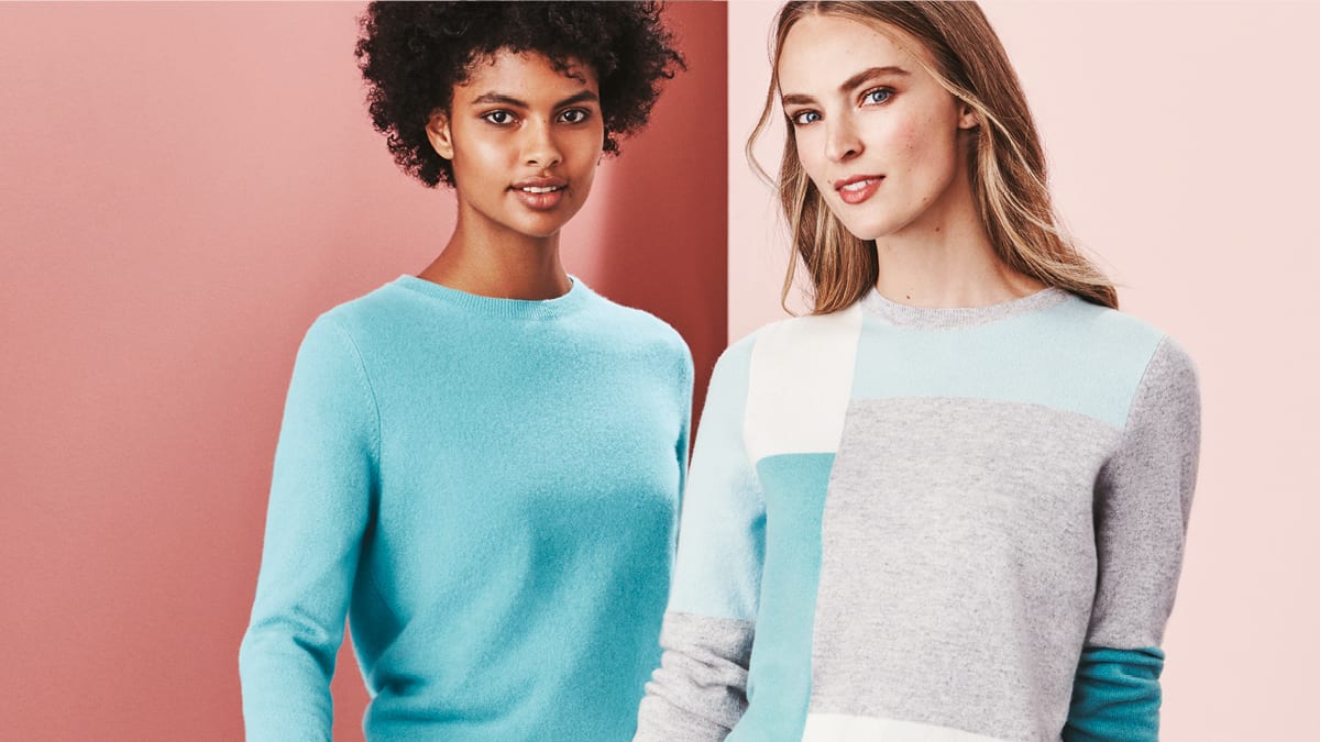 Two women wearing cashmere jumpers