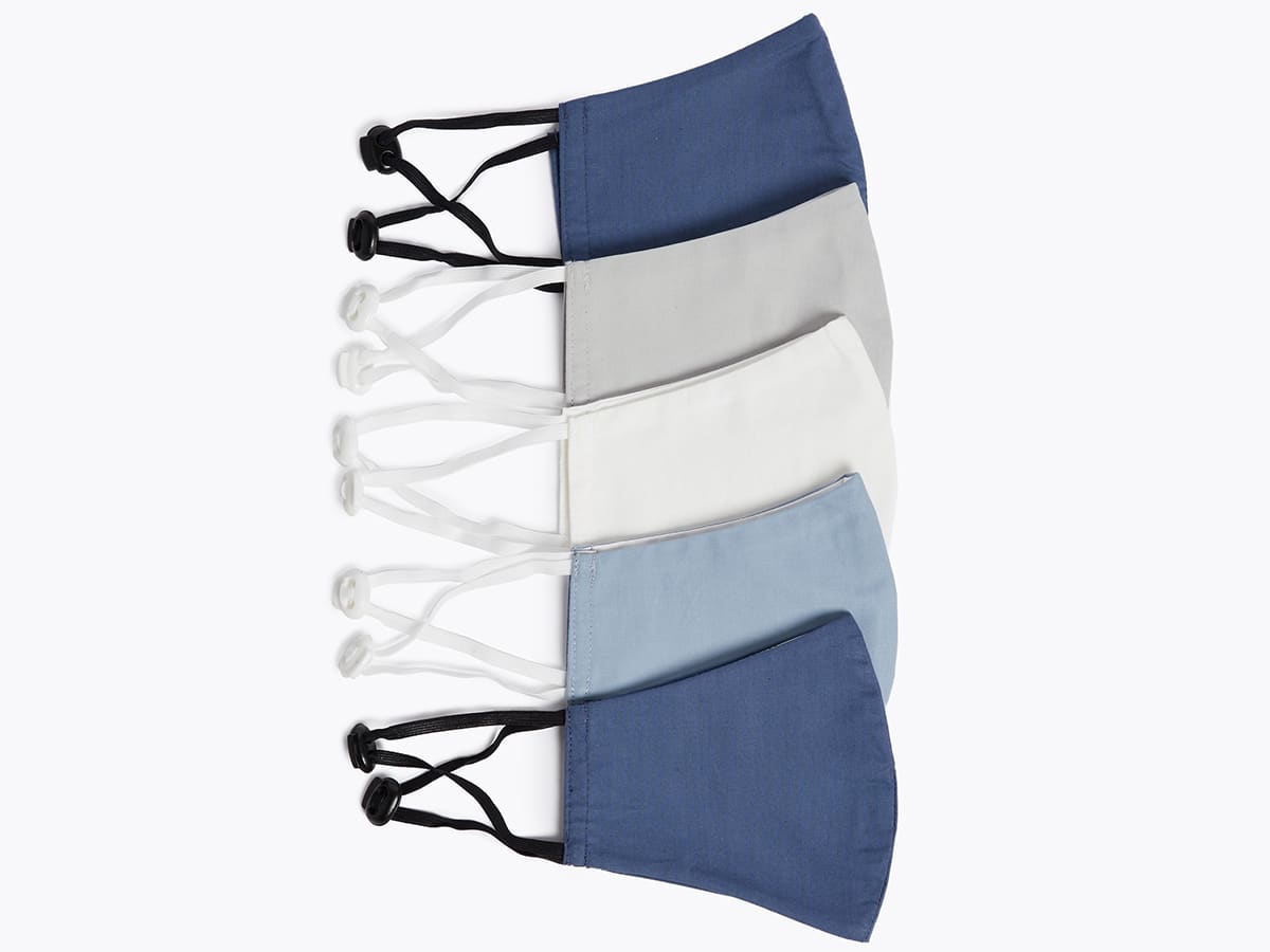 A selection of white, grey and blue face coverings