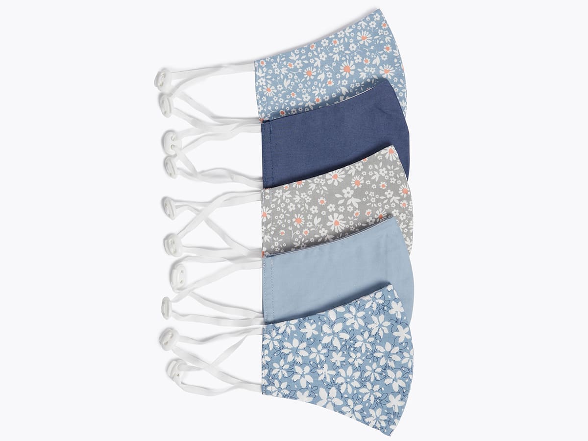 A selection of blue and white floral-print face coverings