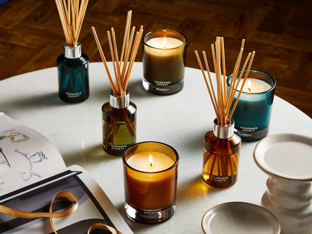 Selection of home fragrances on a table. Shop all offers