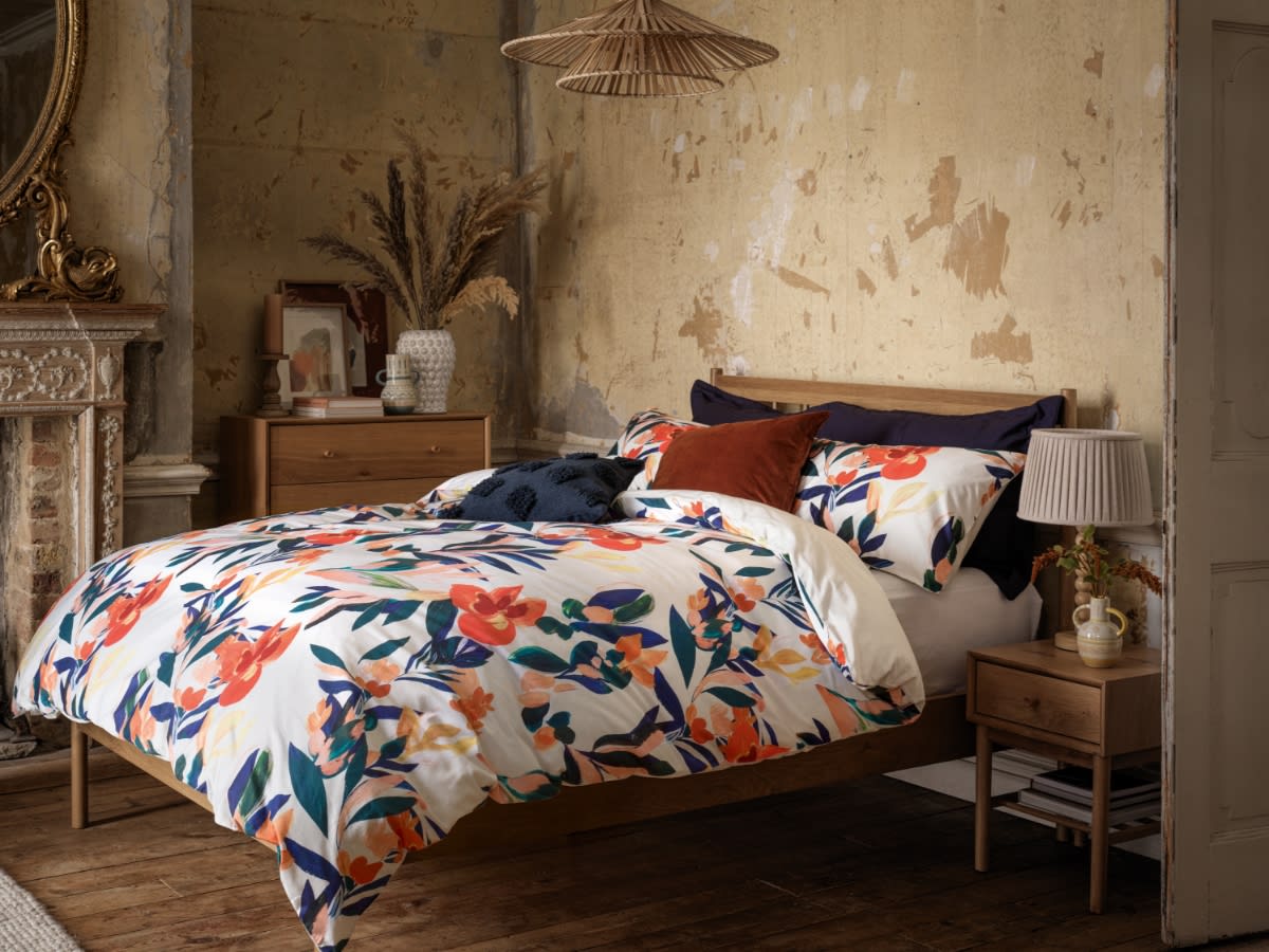 Floral-print bedding on a double bed. Shop all homeware offers