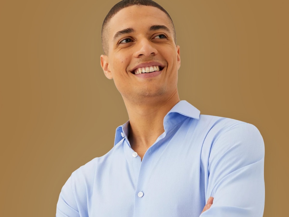 Man wearing smart light blue shirt. Get 2 sartorial shirts for £70 or 3 for £100