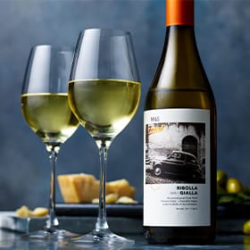 Glasses and bottle of ribolla gialla wine