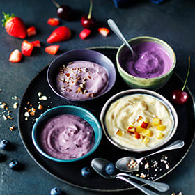 Blueberry yoghurts topped with seeds