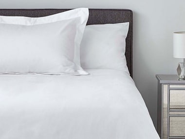 Supima Sateen 750 white duvet cover and pillow cases on bed