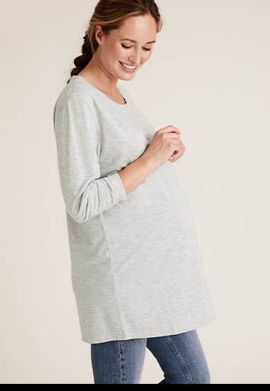 Woman wearing grey marl maternity top