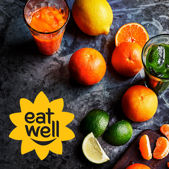 Citrus fruits and glasses of fruit juice