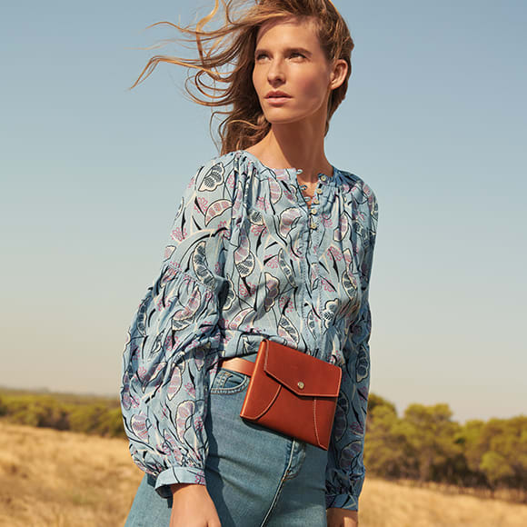 Woman wearing Per Una shirt and jeans