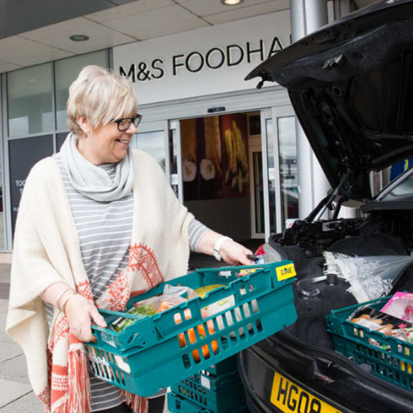 Packing food into car from M&S Foodhall
