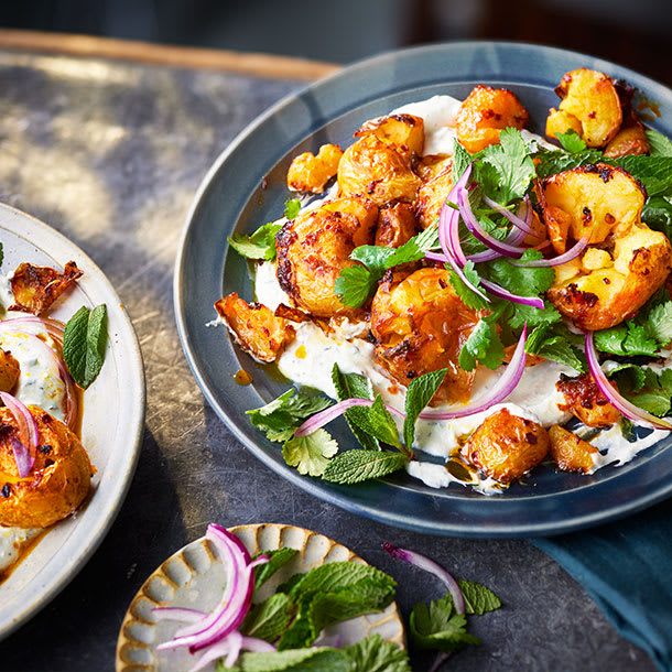 Harissa roasted potatoes with whipped feta and herb salad