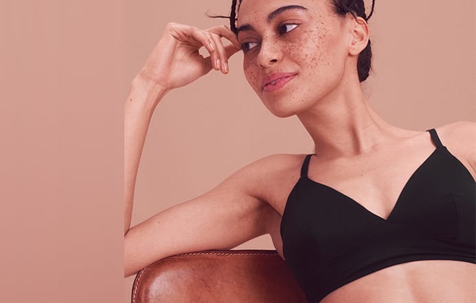Woman wearing black smoothing non-wired bralette