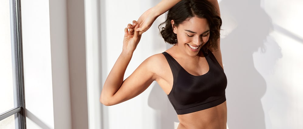 Woman wearing a black Flexifit crop top