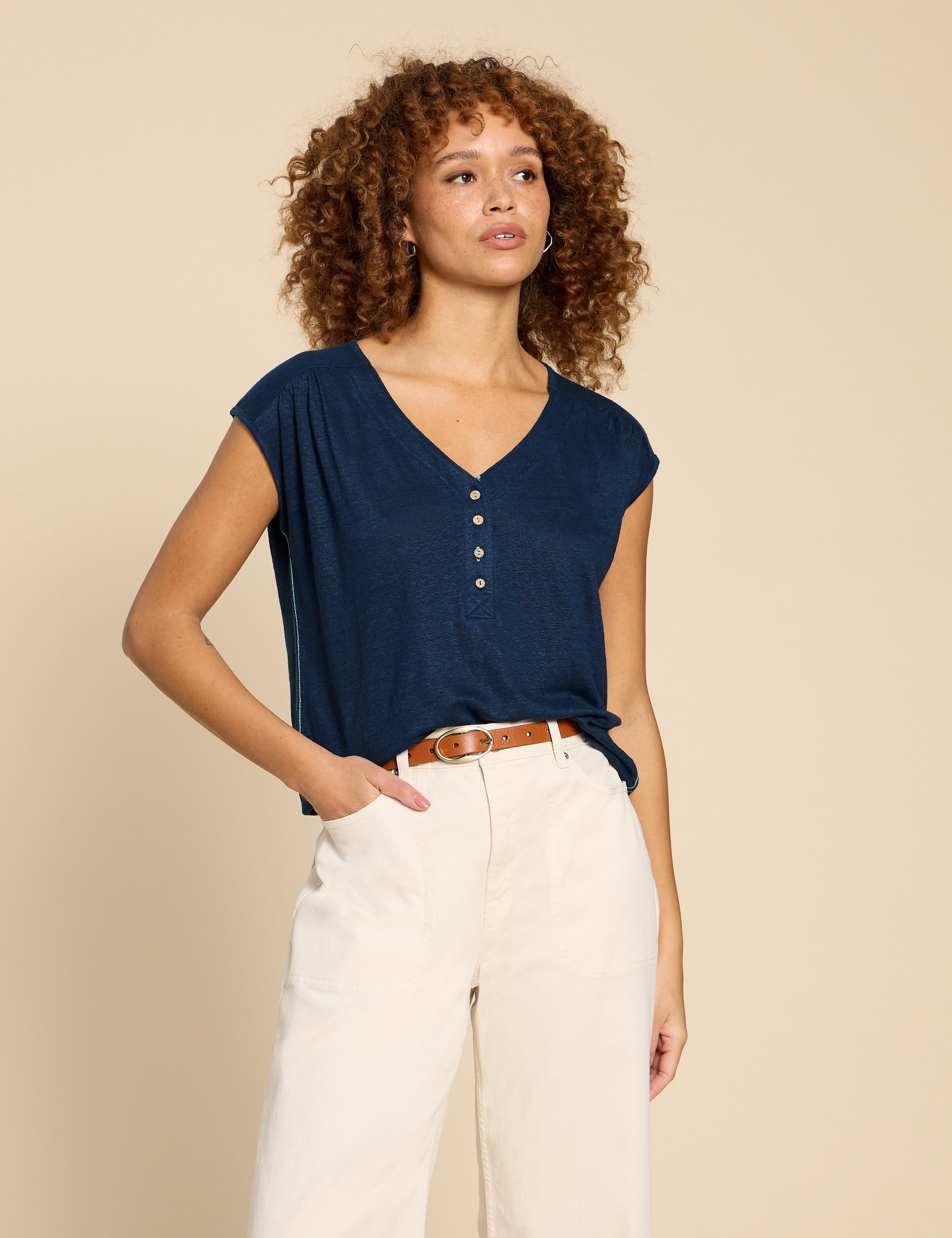 Linen Deep V-Neck Shirt Paired With A White Vest