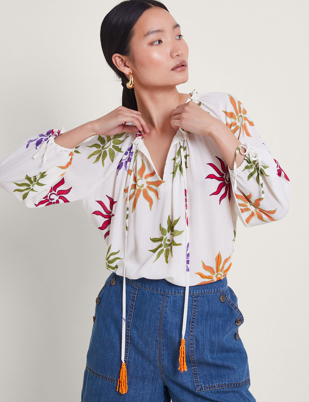 Embroidered Floral Tie Neck Tassel Blouse 1 of 4