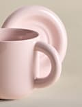 Taza con burbujas y posavasos 