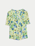 Top de manga abullonada con detalle de botonadura y estampado floral