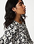 Blusa de manga abullonada con cuello redondo estampada
