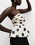 Top bandeau à volant imprimé pois