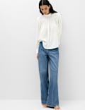 Blusa de manga blus&oacute;n con cuello alto