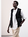 Veste sans manches réversible en daim avec doublure en fausse fourrure