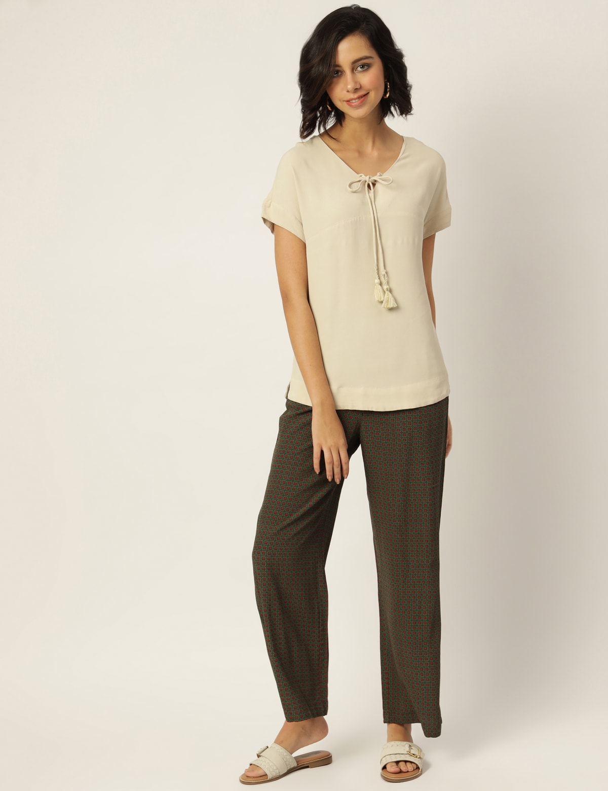 

Marks & Spencer Pure Viscose Self Design Tie-Up Neck Top (FEMALE, LIGHT BUFF, 10)
