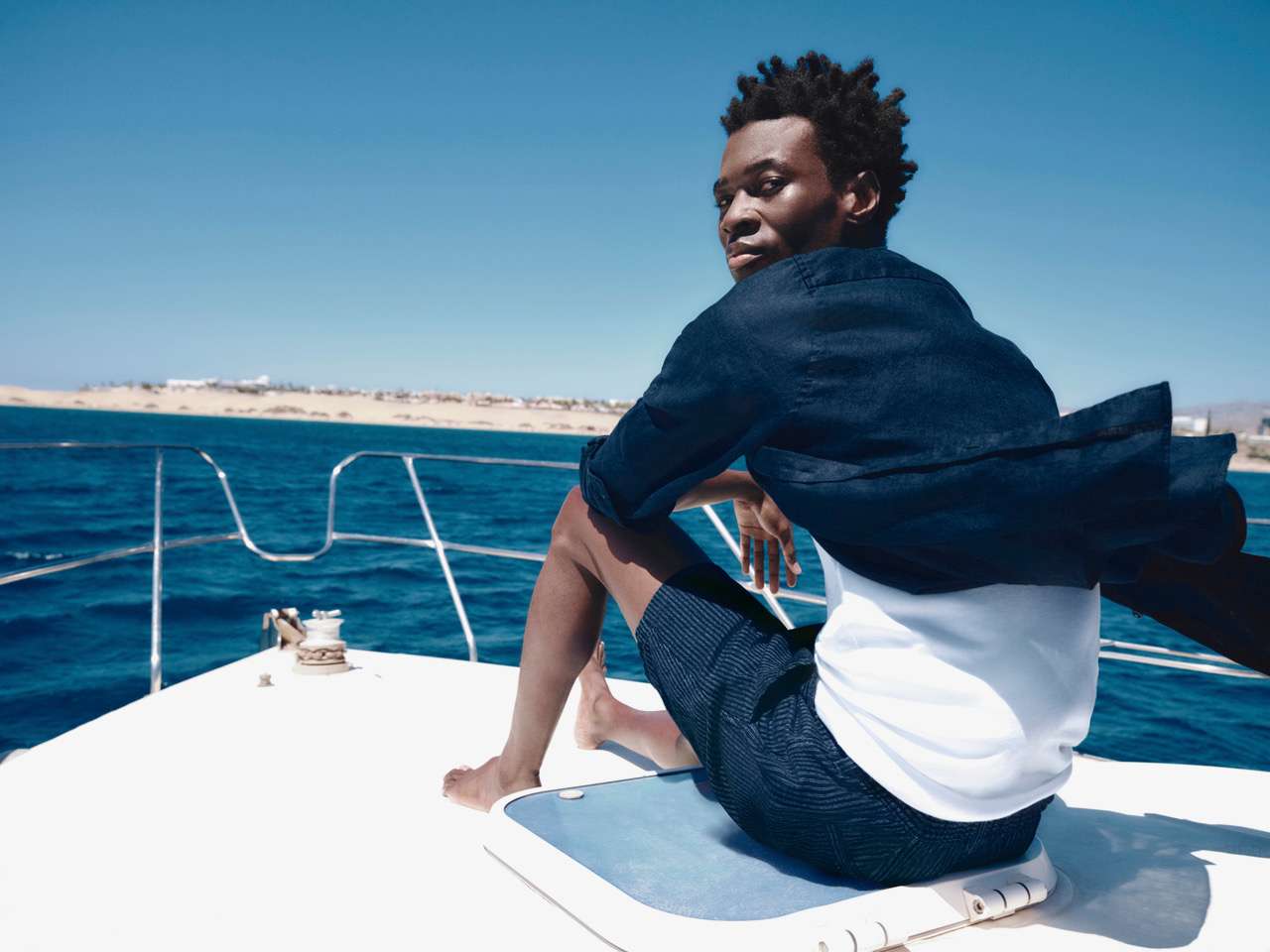 lady relaxing on a small boat in the water