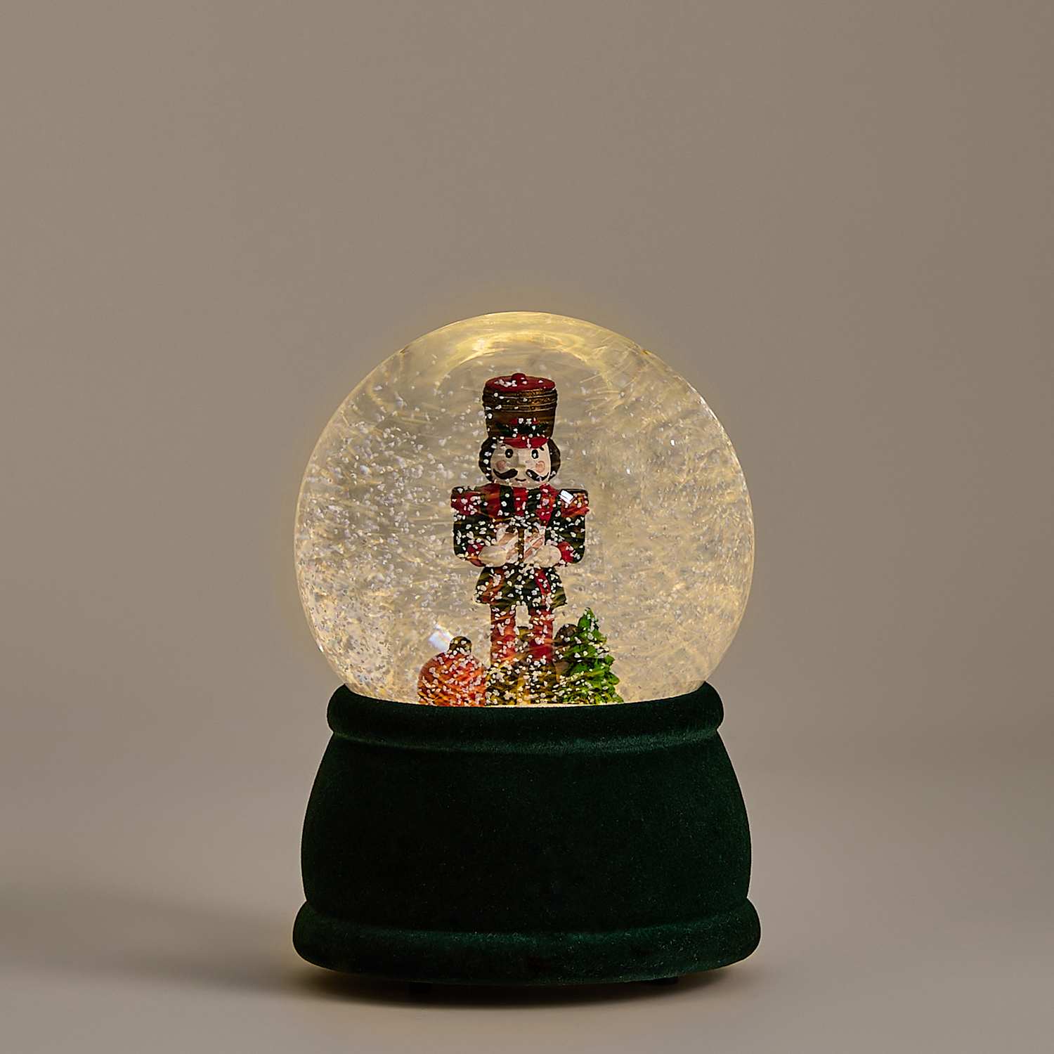 M&S Light Up Nutcracker Snow Globe - Green Mix
