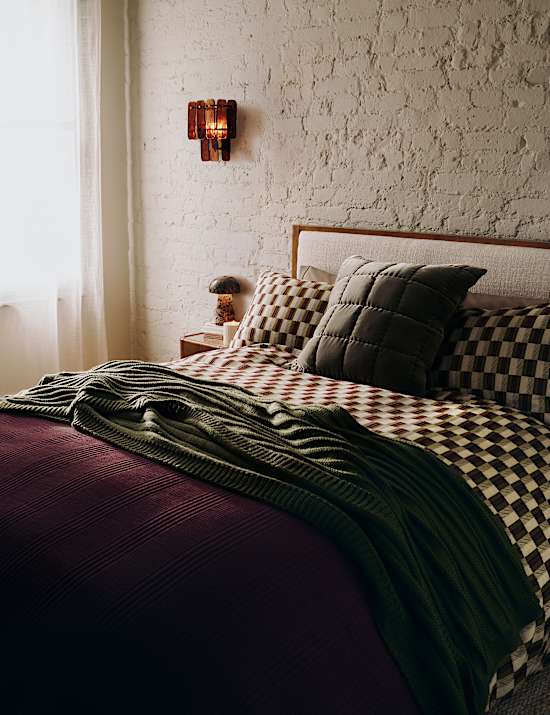 Plaid en maille c&ocirc;tel&eacute;e