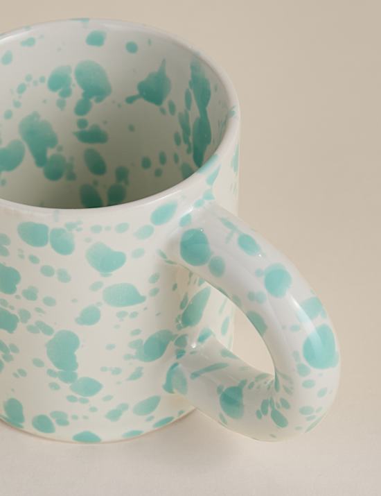 Taza con salpicaduras