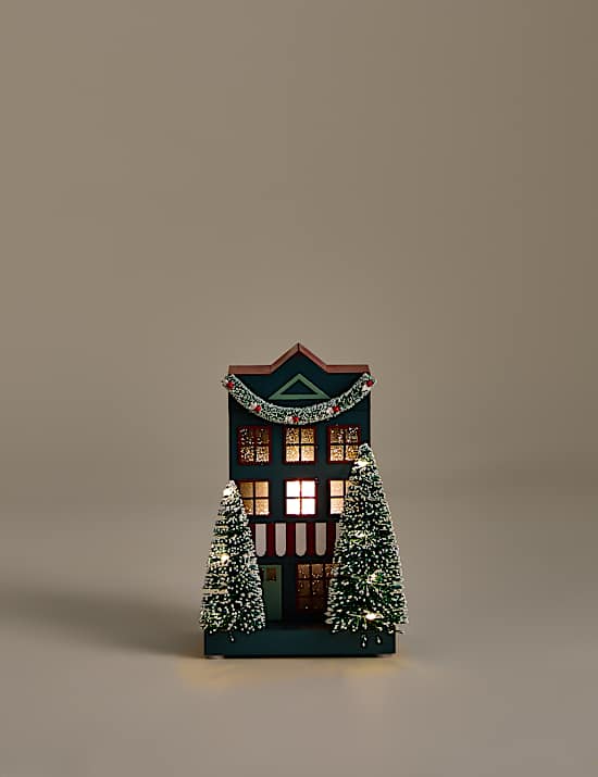 D&eacute;coration lumineuse en bois en forme de maison