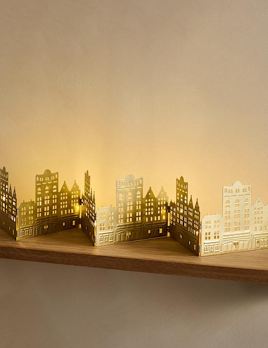 Διακοσμητικό που φωτίζει με σχέδιο σπίτια