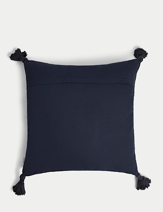 Cojín 100% algodón texturizado con borlas