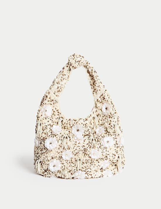 Handtas met kralen op het hengsel