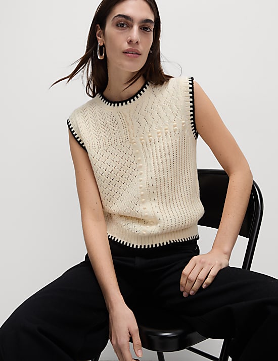 Top de chaleco de punto texturizado con puntadas en fusta