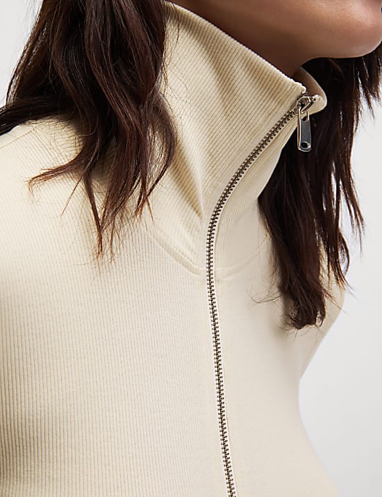 Top de punto de algod&oacute;n con cremallera y cuello ribeteado