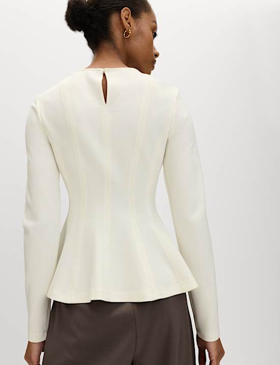 Getailleerde top met lange mouwen en peplum