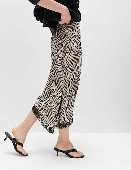 Asymmetrischer Midi-Rock mit Zebraprint und Spitzensaum