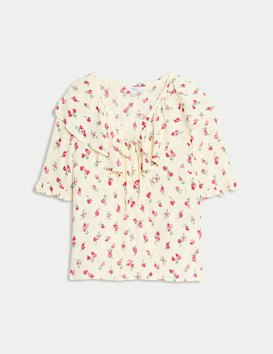 Geblumtes Oberteil mit Bindekragen und Spitzendetail