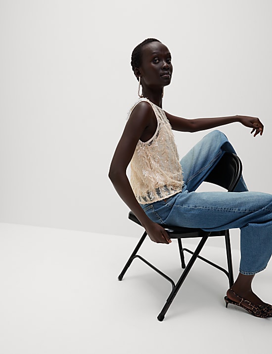 Blouse met lovertjes en verendetail