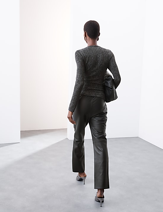 Sprankelende top met boothals en wikkeldetail