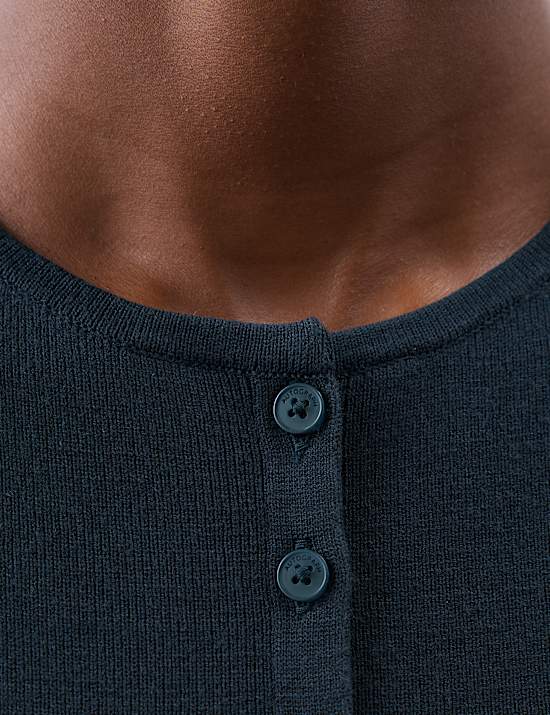 Nauwsluitend lang gilet