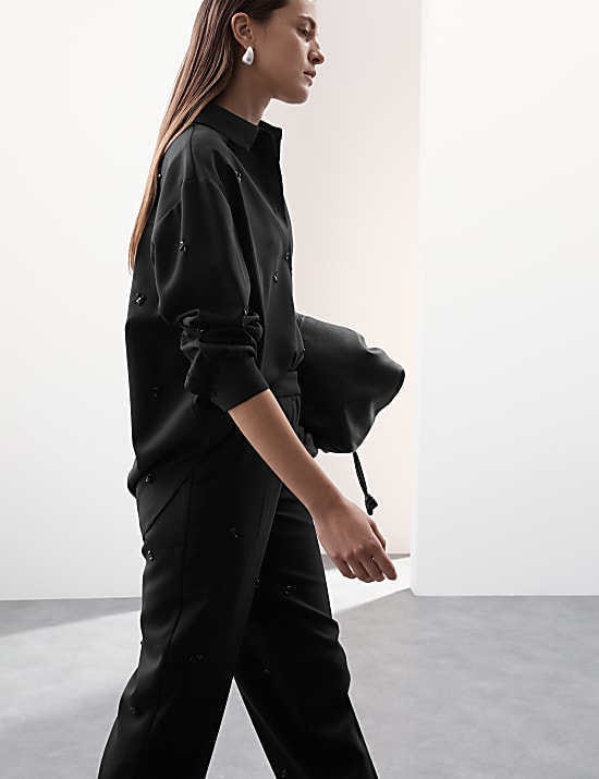 Broek van een wolblend met rechte pijpen en versiering