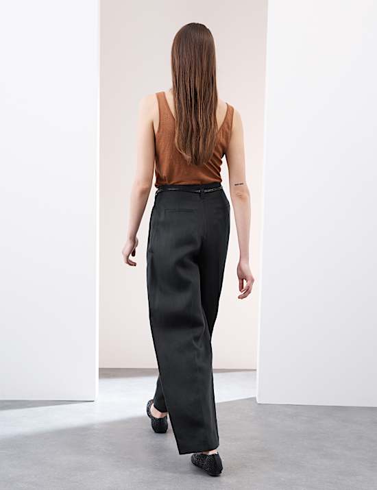 Pantalón tapered de lino con cinturón con pata zanahoria