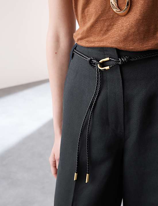 Pantalón tapered de lino con cinturón con pata zanahoria