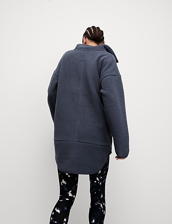 Lang fleecejasje met borgvoering en halflange rits