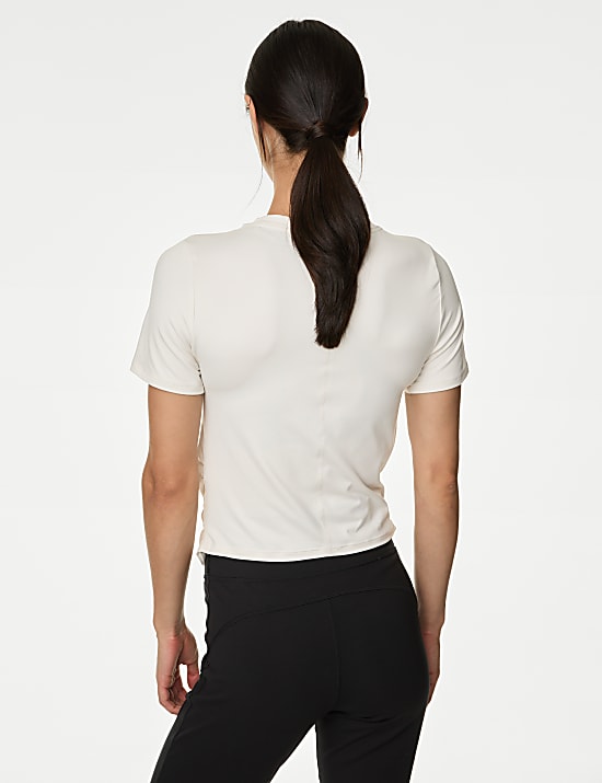 Yoga-T-shirt met lage ronde hals en wikkelstijl voorop