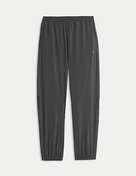 Pantalones deportivos con puños con paneles de tejido de malla