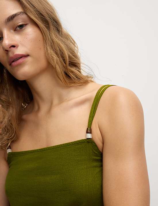 Top estilo camisola largo de lino con abalorios